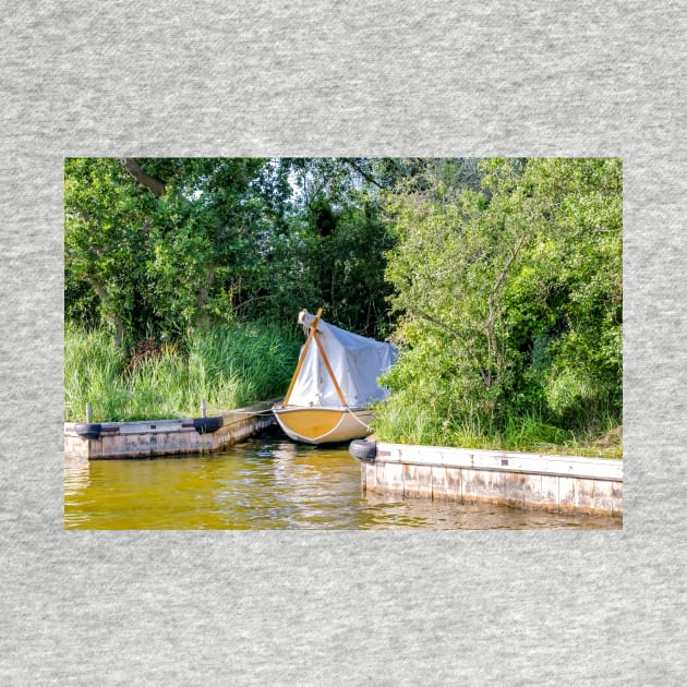 Wooden boat moored in the Norfolk Broads by yackers1